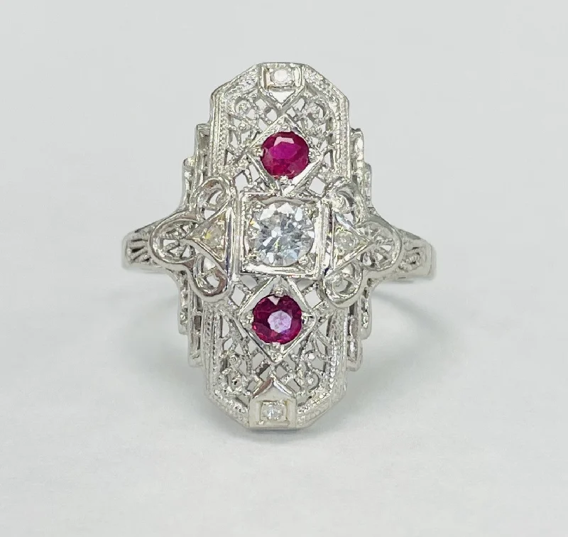 Round diamond engagement rings for women-Vintage Three Stone Mine Cut Diamond And Ruby Ring